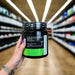Close-up of (BioTechUSA 100% Creatine Monohydrate, Unflavoured 300g) held up inside My Supplement Shop, clearly showing Nutritional Values on the packaging in a Sports Nutrition setting.