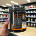 Close-up of (BioTechUSA Citrulline Malate, Green Apple - 300 grams) held up inside My Supplement Shop, clearly showing key ingredients on the packaging in a Sports Nutrition setting.