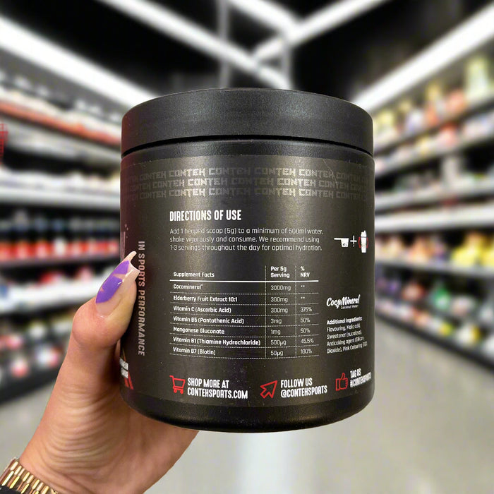 Close-up of (Conteh Sports Hydra Flow Daily Hydration Formula 300g) held up inside My Supplement Shop, clearly showing Nutritional Values on the packaging in a Sports Nutrition setting.